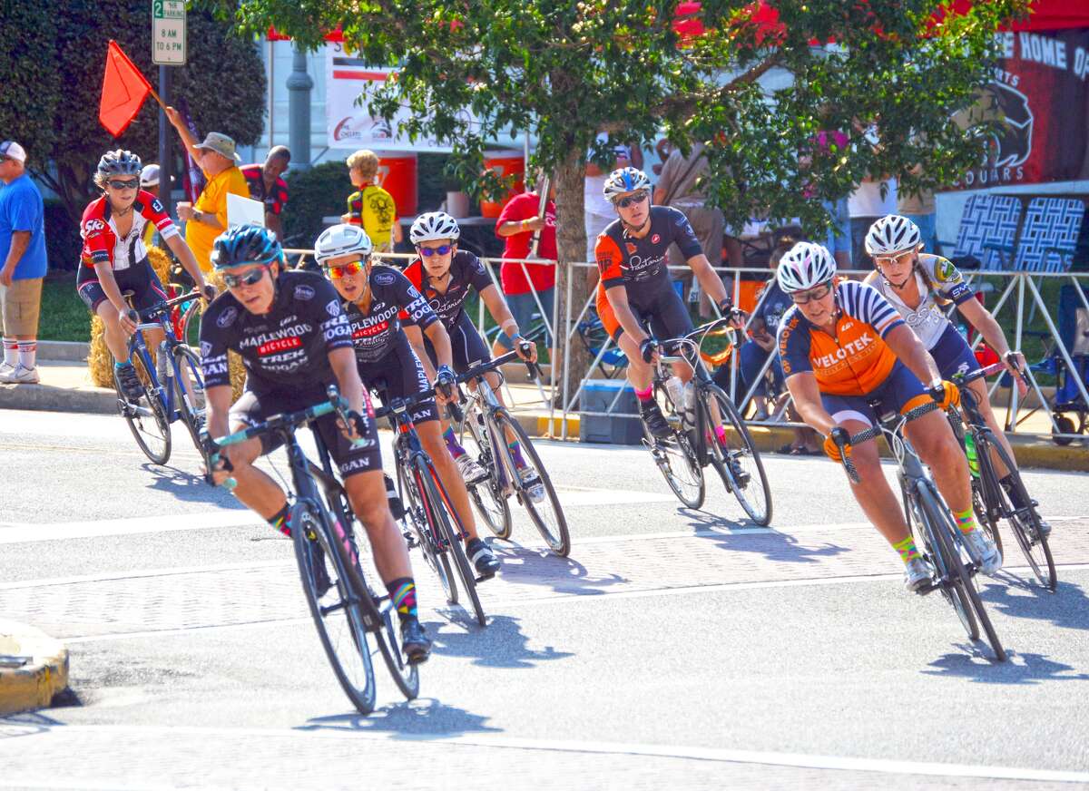 Cyclists turn onto Main Street from St. Louis Street in downtown during the eighth edition of TheBank of Edwardsville Rotary Criterium on Saturday.