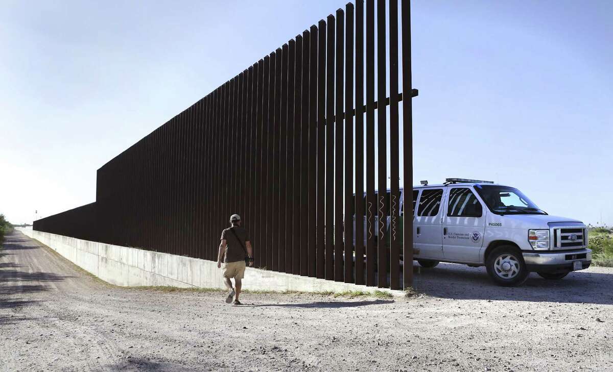 Scott Nicol, Co-Chairman of the Borderlands Team for the Sierra Club walks along a break in the border wall in Hidalgo, TX, near the Santa Anna National Wildlife Refuge, on Thursday, Aug. 17, 2017.