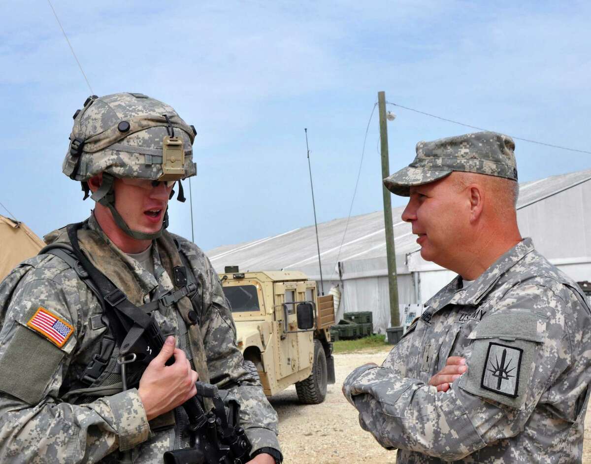 New York Army National Guard Commander Brig. Gen. Raymond Shields (left) visits Soldiers of New York?s 27th Infantry Brigade Combat Team to discuss their training at the Army?s Joint Readiness Training Center, Fort Polk, Louisiana, Saturday, July 16, 2016. Approximately 3,000 Soldiers from New York joined 2,000 other state Army National Guard units, active Army and Army Reserve troops as part of the 27th Infantry Brigade Combat Team task force. The Soldiers are honing their skills and practicing integrating combat operations ranging from infantry troops engaging in close combat with an enemy to artillery and air strikes, July 9-30, 2016. U.S. Army National Guard photo by Sgt. Maj. Corine Lombardo.