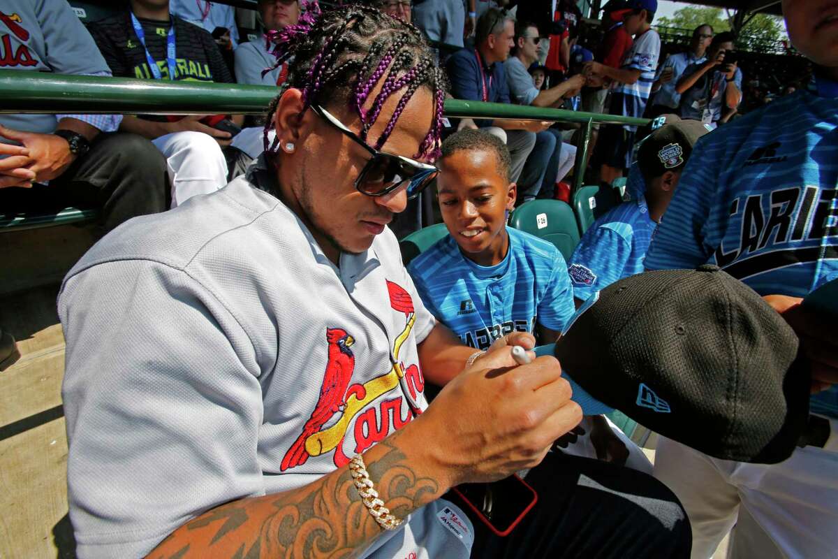 Pirates and Cardinals players celebrate Little League Classic with