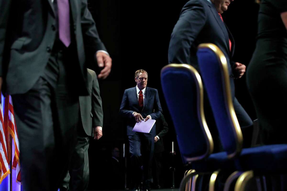 U.S. Trade Representative Robert Lighthizer, center, arrives for a news conference, Wednesday, Aug. 16, 2017, at the start of NAFTA renegotiations in Washington. (AP Photo/Jacquelyn Martin)