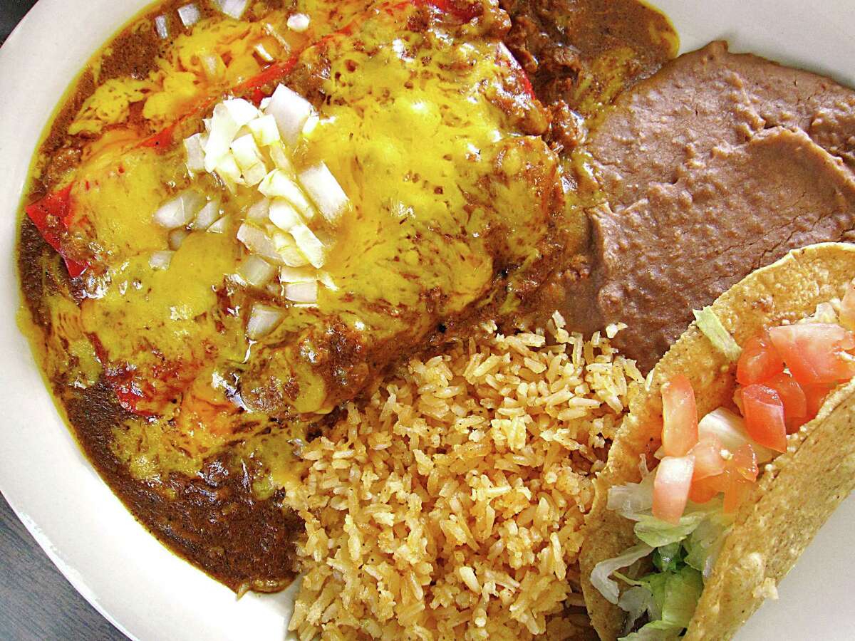 A #1 Mexican Dinner with cheese enchiladas, chile con carne gravy, a tamale, rice, beans and a crispy beef taco from Garcia's Mexican Food on Fredericksburg Road in San Antonio.
