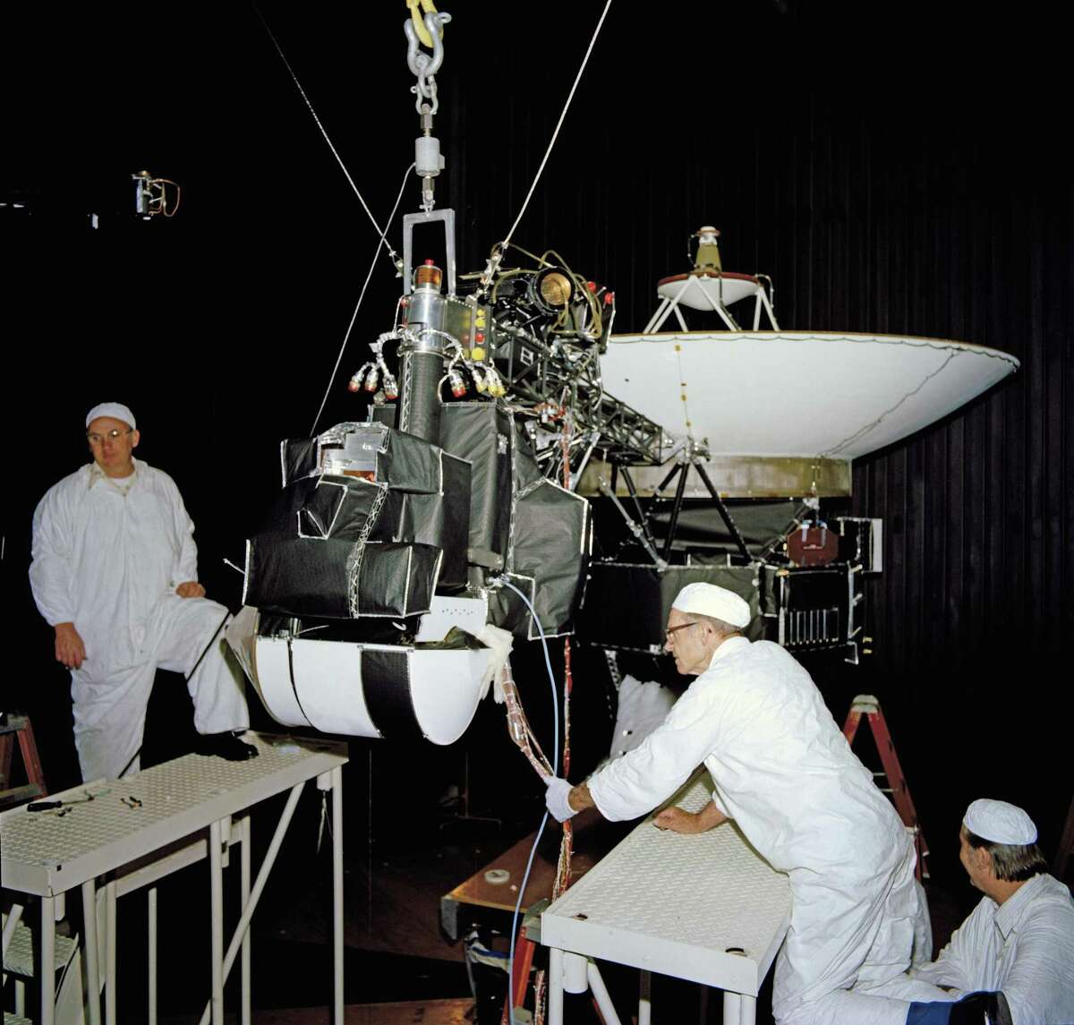 This image shows one of the Voyagers in the 25-foot space simulator chamber at NASA's Jet Propulsion Laboratory in Pasadena, California. The photo is dated April 27, 1977.