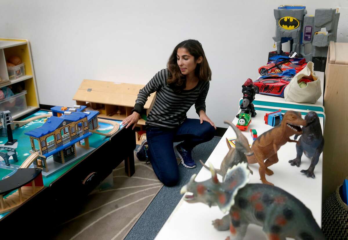 Michaela Azzopardi rearranges an assortment of toys at her job as a childcare specialist for Support for Families of Children with Disabilities in San Francisco, Calif. on Saturday, Aug. 19, 2017. Azzopardi has filed a claim seeking unpaid back wages from a previous employer, Wondersitter, which filed for bankruptcy.