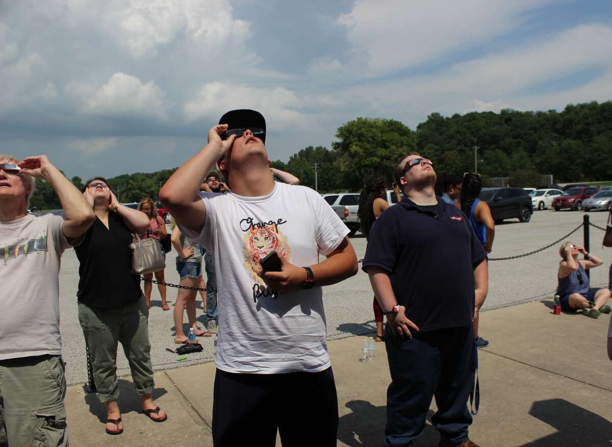 The sky got dimmer during Monday's solar eclipse as crowds gathered at SIUE's Korte Stadium for a public viewing event. 
