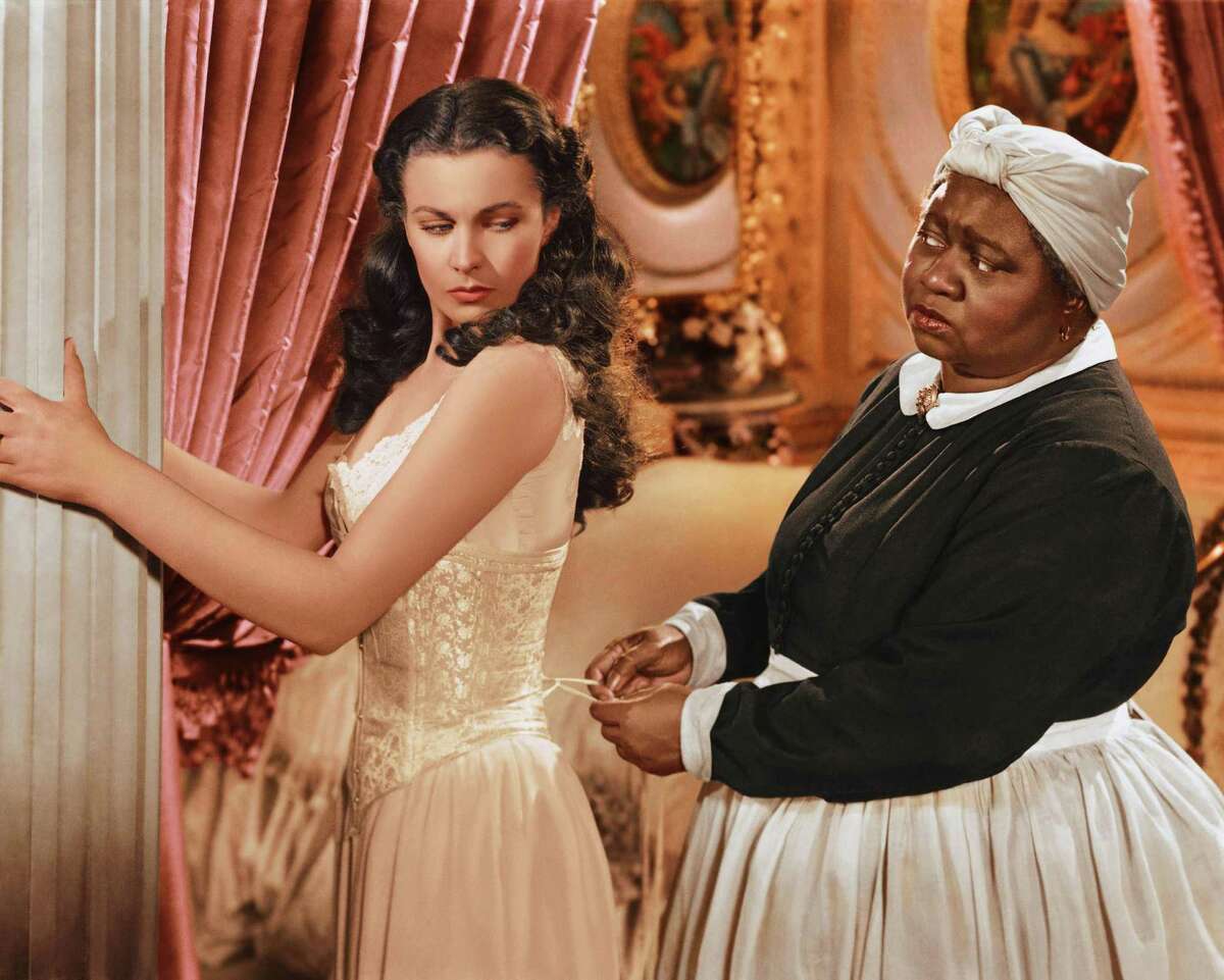 Among Polunsky’s favorite movies was “Gone With the Wind.” Here, Vivien Leigh (1913-1967), British actress, has her corset tightened by Hattie McDaniel in a publicity still.