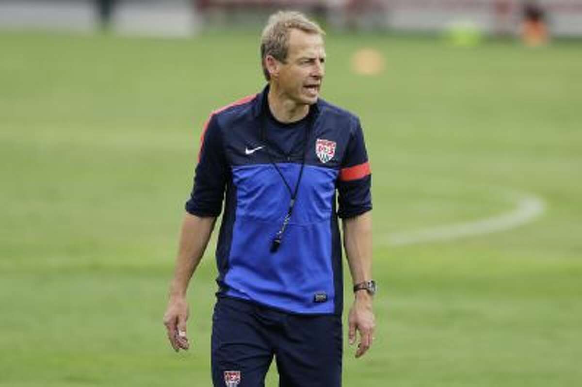 U.S. coach Jurgen Klinsmann works with his team in a training session in Brazil.