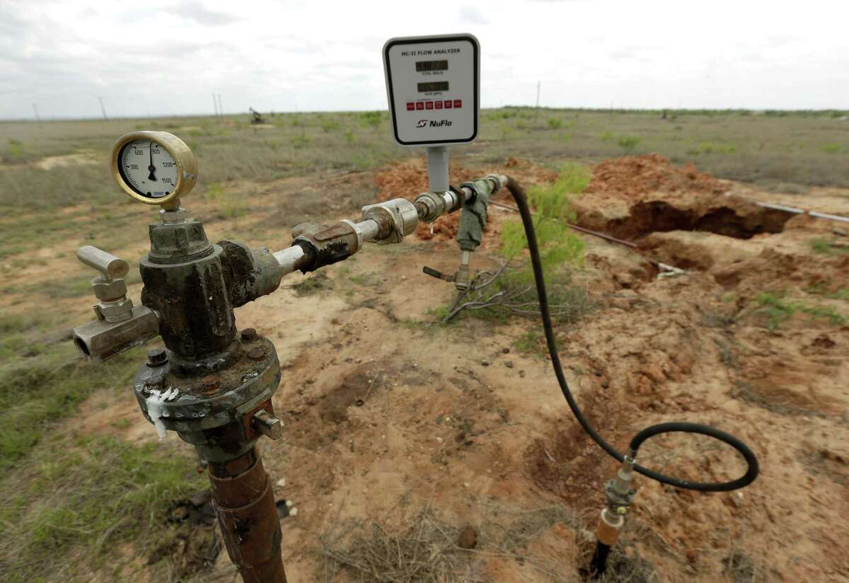 A wastewater disposal well stands near the spot where a pipeline ruptured on land owned by Wesley Graves near Snyder, Texas.