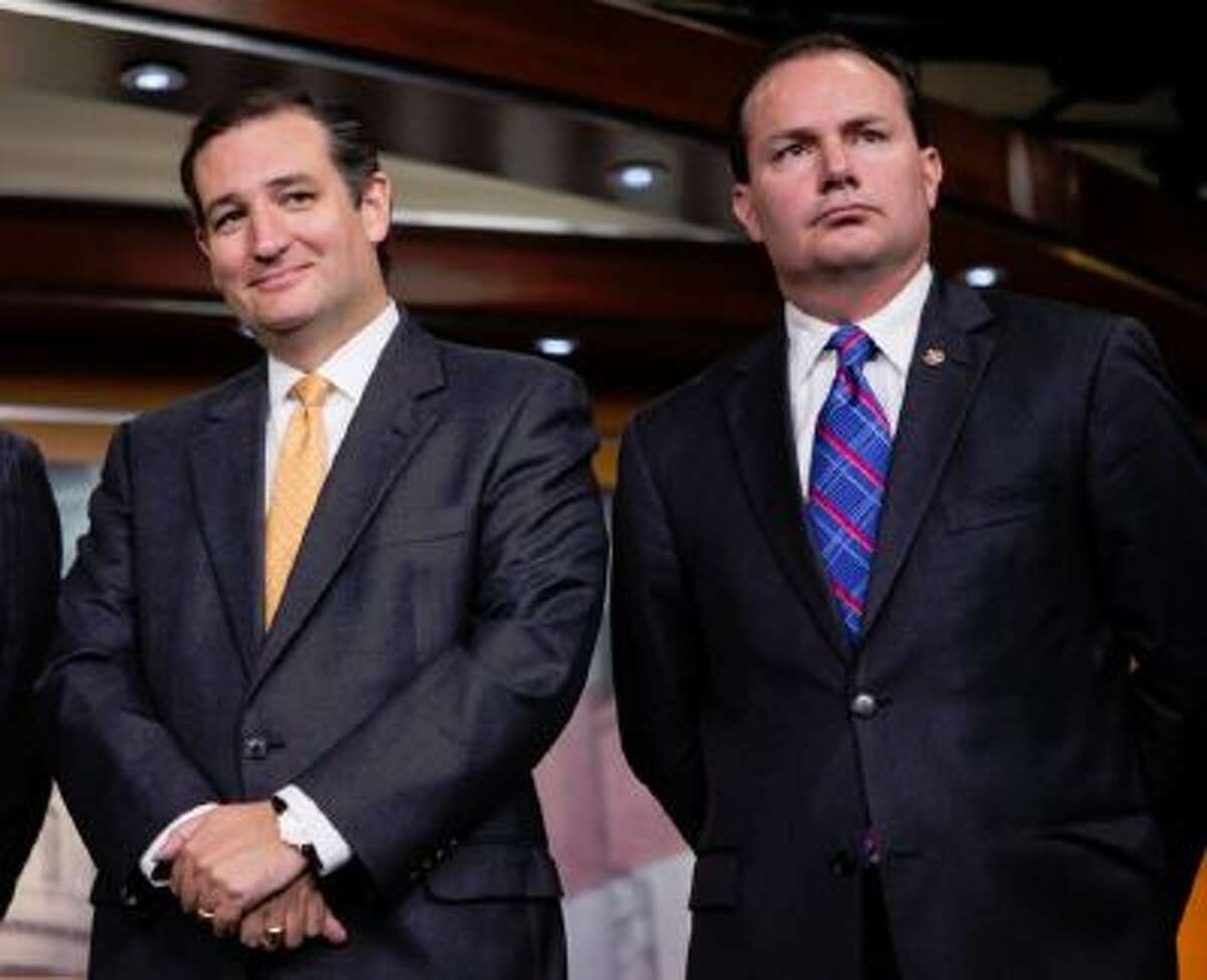 Sen. Ted Cruz, R-Texas, left, and Sen. Mike Lee, R-Utah, during a news conference with conservative Congressional Republicans at the Capitol in Washington, Thursday, Sept. 19, 2013. Cruz and Lee stand as the Senate's dynamic duo for conservatives, crusading against President Barack Obama's health care law while infuriating many congressional Republicans with a tactic they consider futile, self-serving and detrimental to the party's political hopes in 2014.
