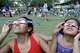 Melissa Solorzano and her daughter, Sofia Solorzano, 4, watch the eclipse at Levy Park, 3801 Eastside St., Monday, Aug. 21, 2017, in Houston. The event at the park was sponsored by the Levy Park Conservancy and the Lunar Planetary Institute.