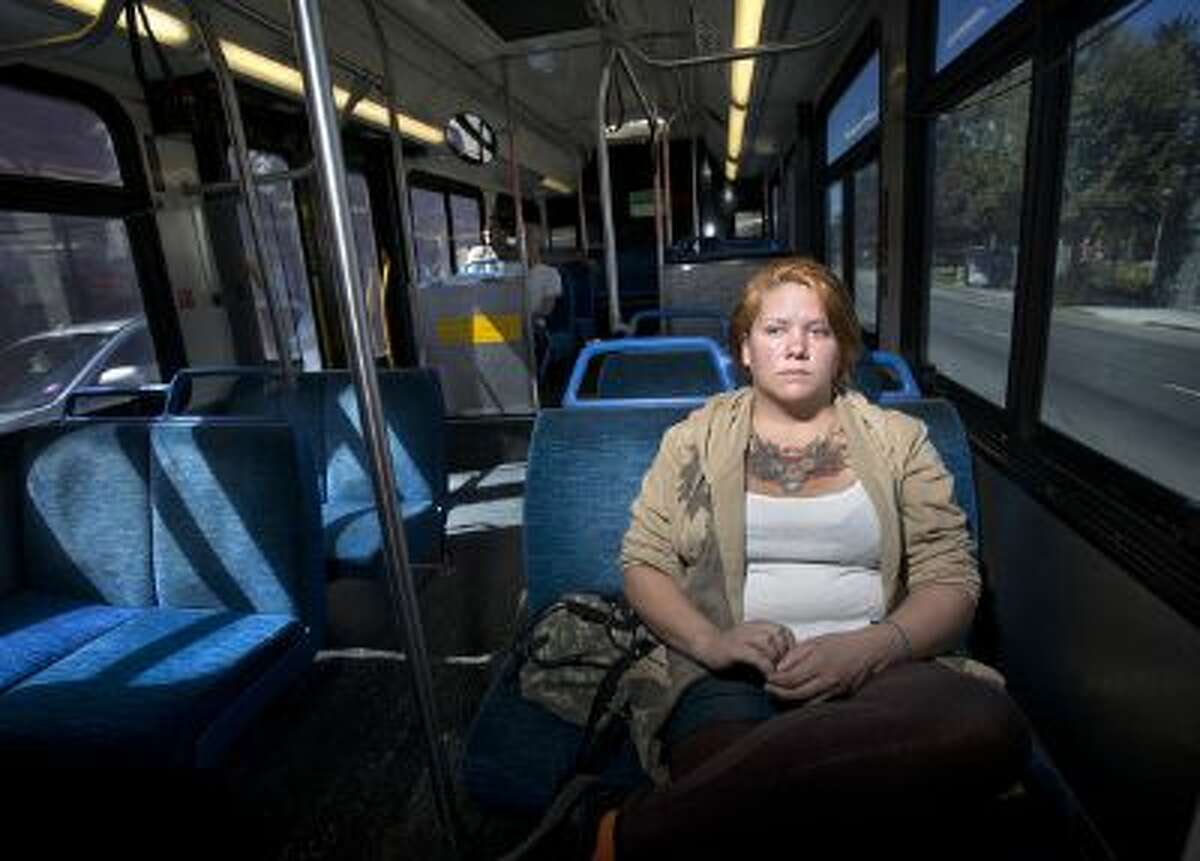 Bailey DeCarlo, 24, on the VTA No. 22 bus in downtown San Jose on Friday, Aug. 30, 2013. When she was homeless she says she sometimes rode the bus for hours to stay out of the elements and to sleep. She now has a job and is staying with family.