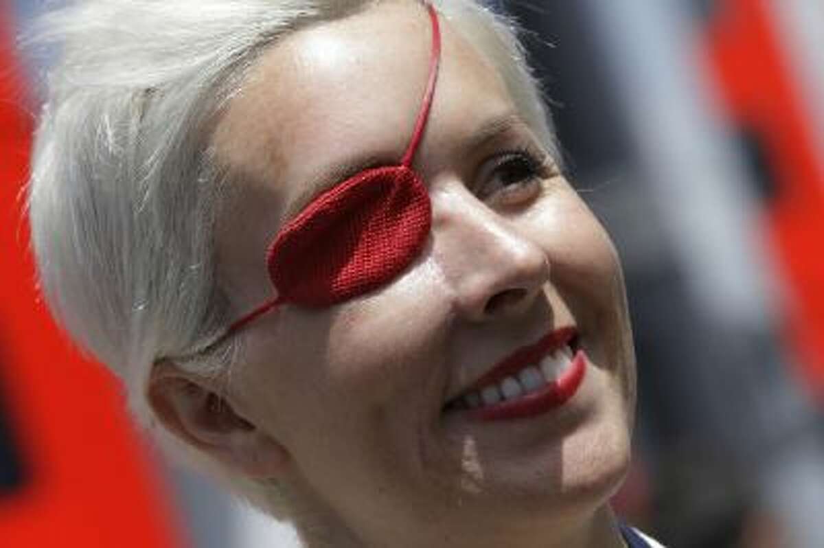 FILE - In this May 11, 2013 file photo, Spanish former F1 driver Maria De Villota smiles in the paddock at the Catalunya racetrack in Montmelo, near Barcelona, Spain. Spanish police have confirmed that racing driver Maria de Villota has been found dead in a hotel room in Seville, and say it appears she died of natural causes. She was 33. In July 2012, De Villota crashed while test driving a car for F-1 team Marussia. She lost her right eye in the accident.