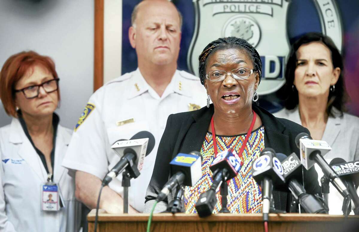 (Arnold Gold-New Haven Register) Dr. Martha Okafor (center), Community Services Administrator, speaks at a press conference at the New Haven Police Department on 6/24/2016 concerning the spike in synthetic drug overdoses in New Haven and surrounding towns.