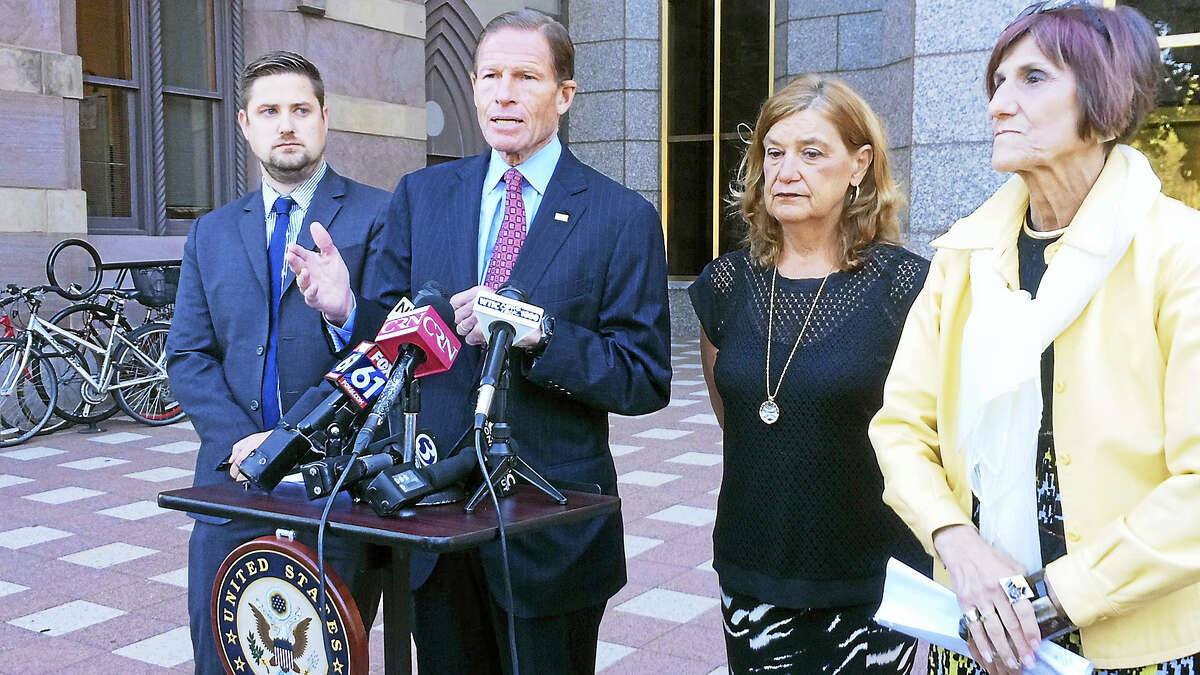 (Wes Duplantier/The New Haven Register)Speaking Monday near the federal courthouse in New Haven, U.S. Sen. Richard Blumenthal, D-Conn., and U.S. Congresswoman Rosa DeLauro, D-3, called on President Barack Obama to sign legislation to allow the families of 9/11 victims to sue foreign actors. They were joined by Brett and Gail Eagleson, the son and wife of Bruce Eagleson, who died in the attacks.