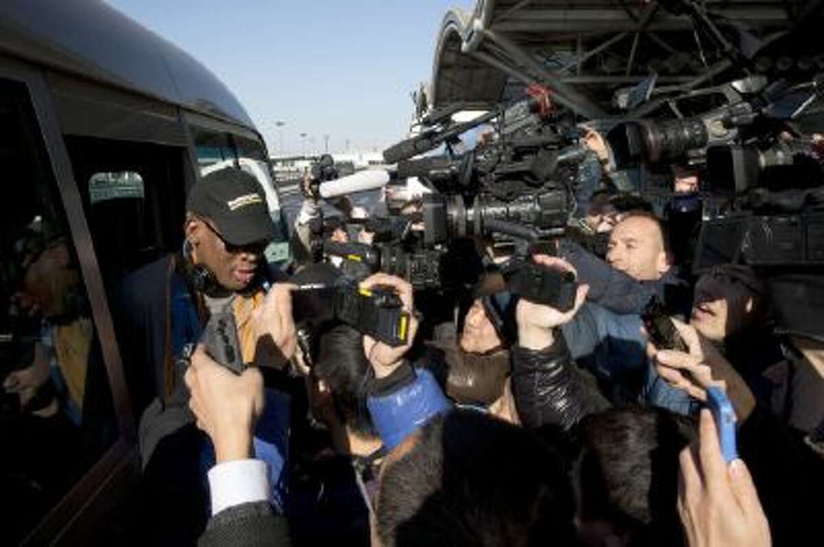 Dennis Rodman arrives at the capital airport for a flight to North Korea in Beijing, China.