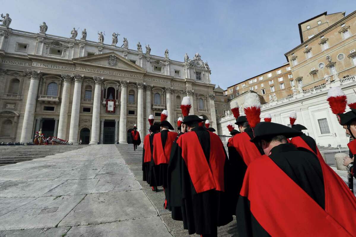 The Carabinieri band march in front of Peter's Basilica at the Vatican, Sunday, Dec. 25, 2016. Saturday's late night Mass was the first major event of the Christmas season, followed by Francis' noon Urbi et Orbi (To the city and the world) blessing on Christmas day. (AP Photo/Alessandra Tarantino)