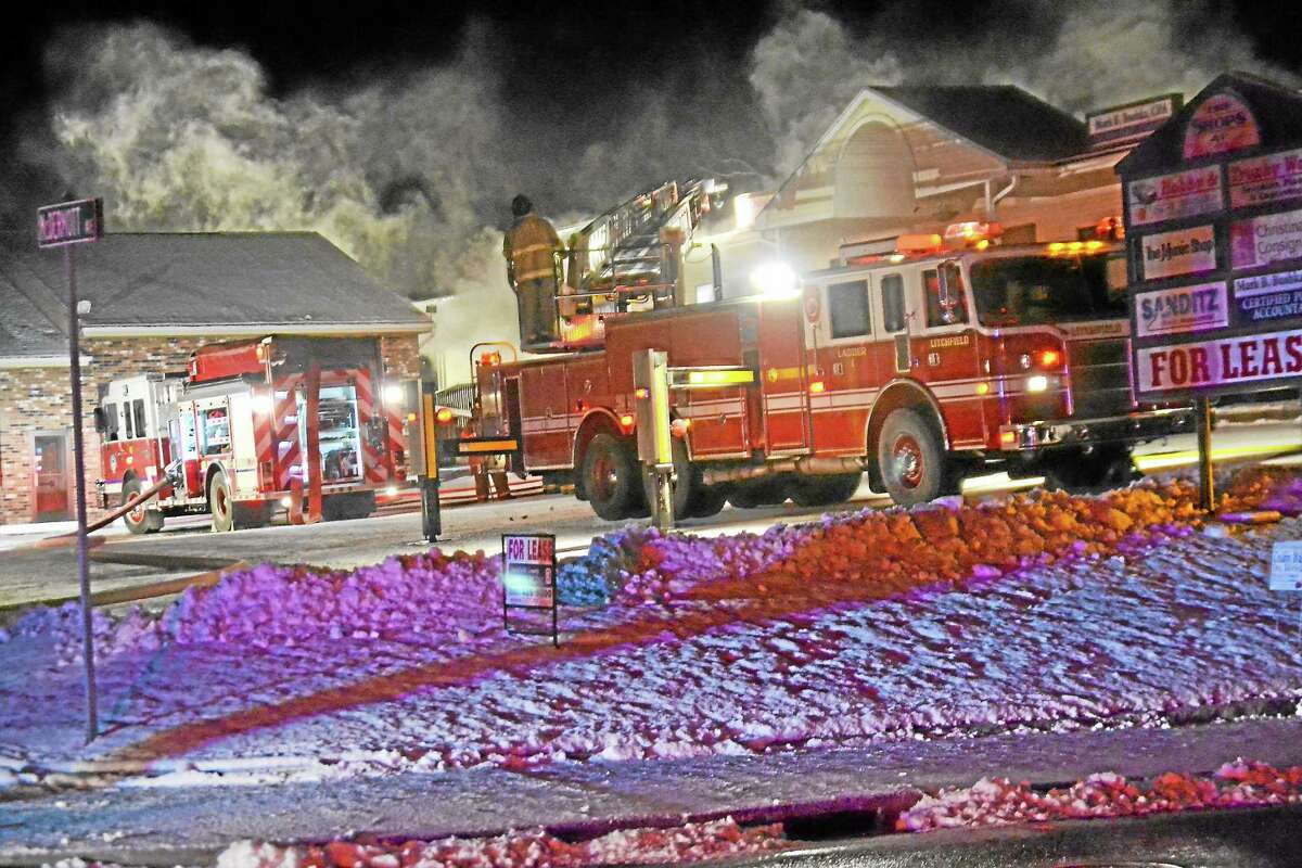 Tom Cleary Register Citizen Firefighters battled a 3-alarm blaze at Carl’s True Value on North Elm Street in Torrington early Wednesday morning, Dec. 11, 2013.