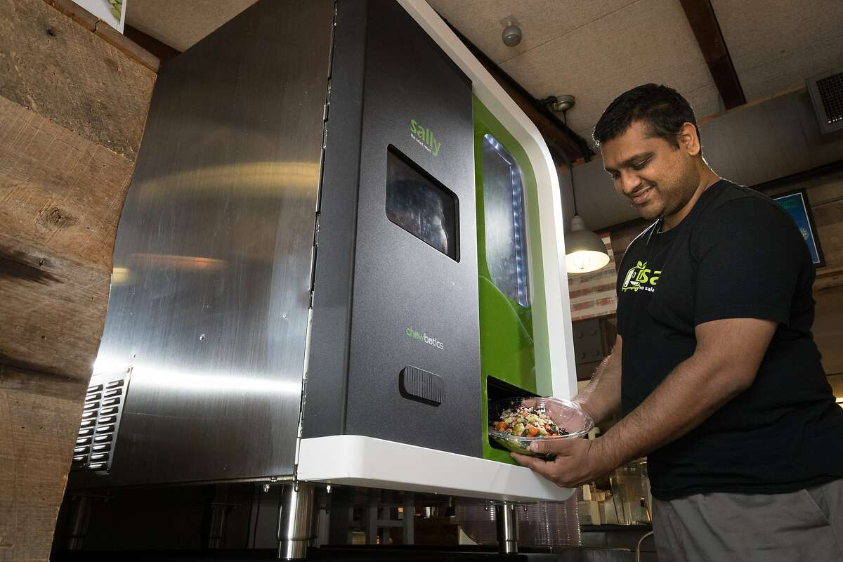 Deepak Sekar, CEO, founder, Chowbotics demonstrates a robot made by startup Chowbotics making a salad at Calafia Cafe in the Town and Country Village shopping center on Monday, Aug. 21, 2017 in Palo Alto, CA.