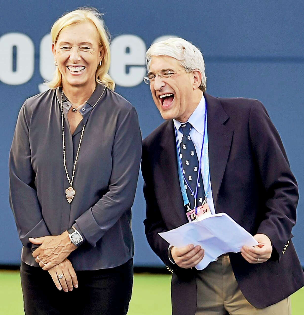 (Peter Hvizdak / Hearst Connecticut Media) New Haven,Connecticut: Monday, August 21, 2017. Legendary tennis player Martini Navratilova and Yale University President Peter Salovey share a light moment at the start of the Connecticut Open 20th Anniversary Celebration Opening Ceremony Monday evening at the Connecticut Tennis Center.