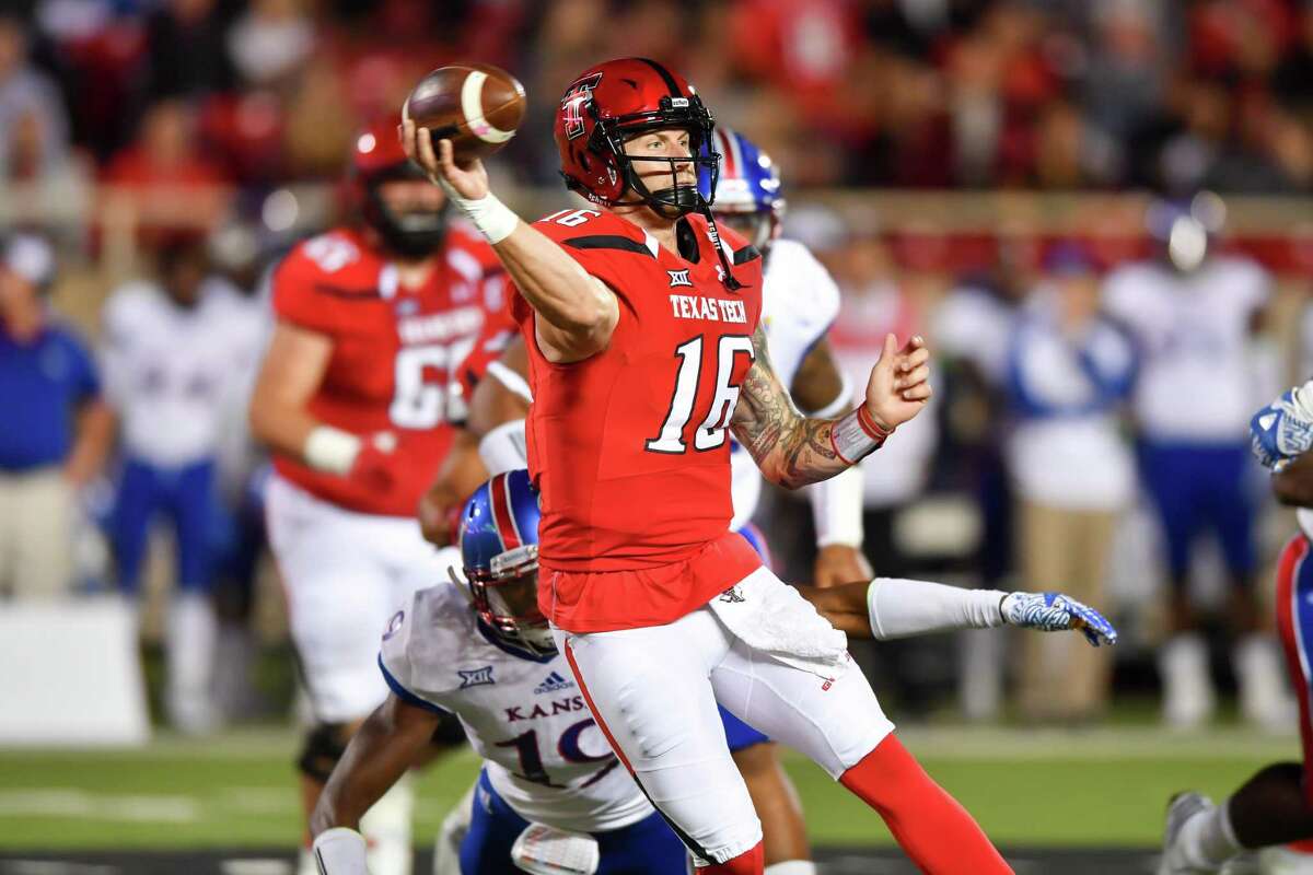 LUBBOCK, TX - SEPTEMBER 29: Nic Shimonek #16 of the Texas Tech Red Raiders passes the ball under pressure during the game against the Kansas Jayhawks on September 29, 2016 at AT&T Jones Stadium in Lubbock, Texas. Texas Tech won the game 55-19. (Photo by John Weast/Getty Images)