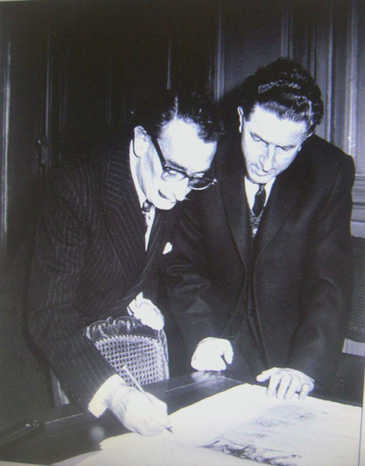 Salvador Dali with his publisher Pierre Argillet.