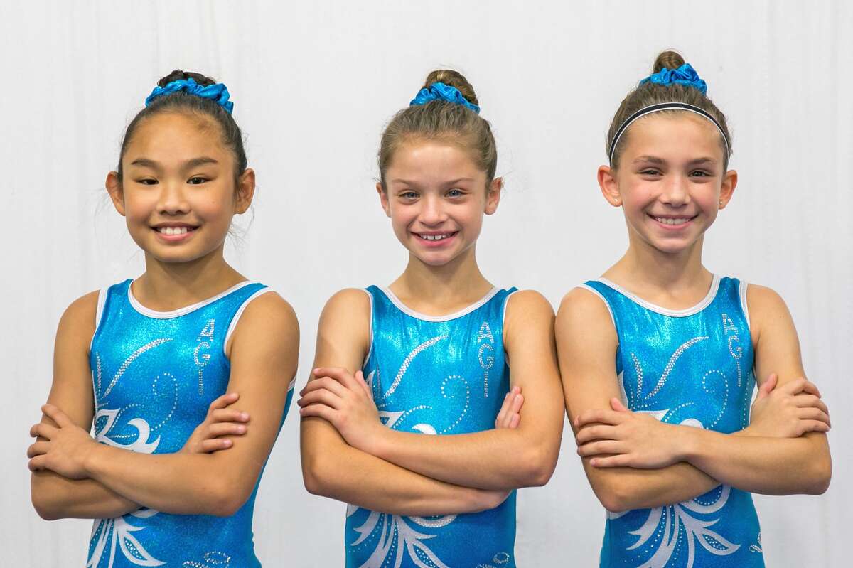 Gymnasts competing for Artistic Gymnastics Institute at the U.S. National Training Center are, from left to right, Maya Taylor, Lilly Trettenero and Reese Hampton.