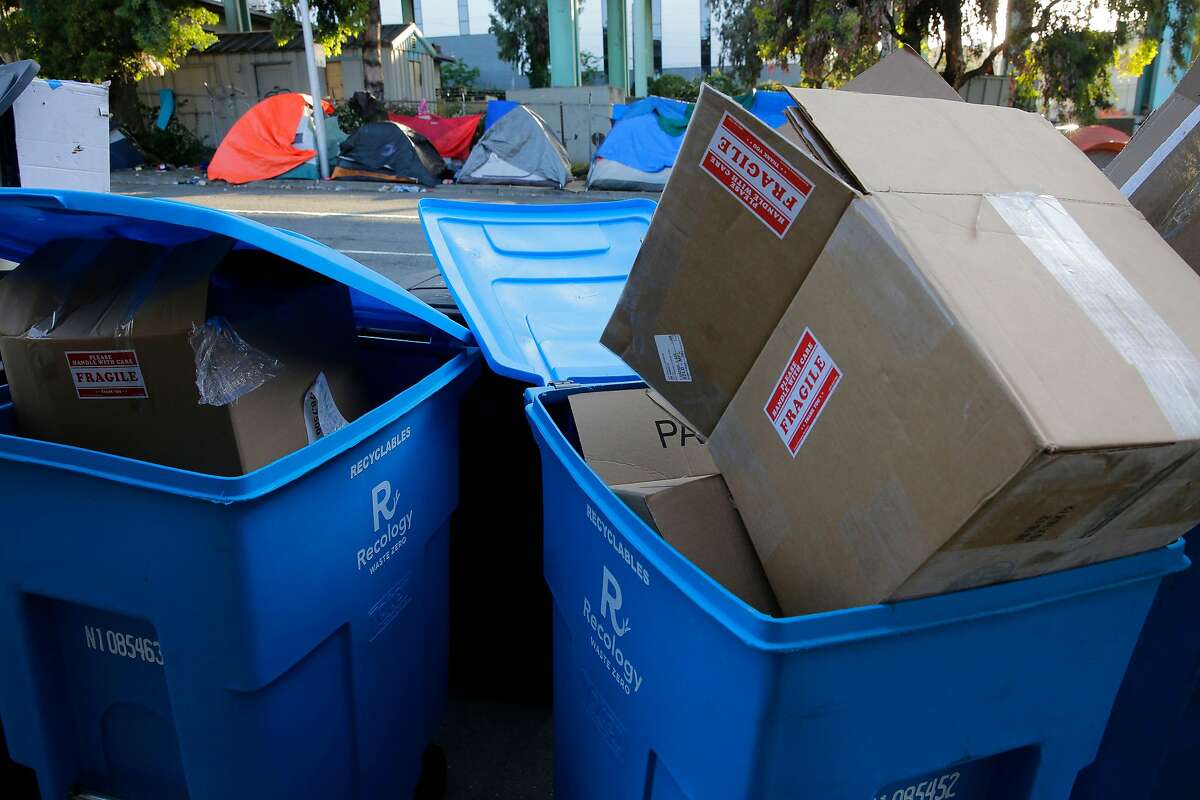 Recycling bins put out the night before for pick up in the morning along Vermont St., have become the targets of the homeless who camp nearby who rummage through cans at night looking for recyclables, creating a mess on the street and sidewalk.