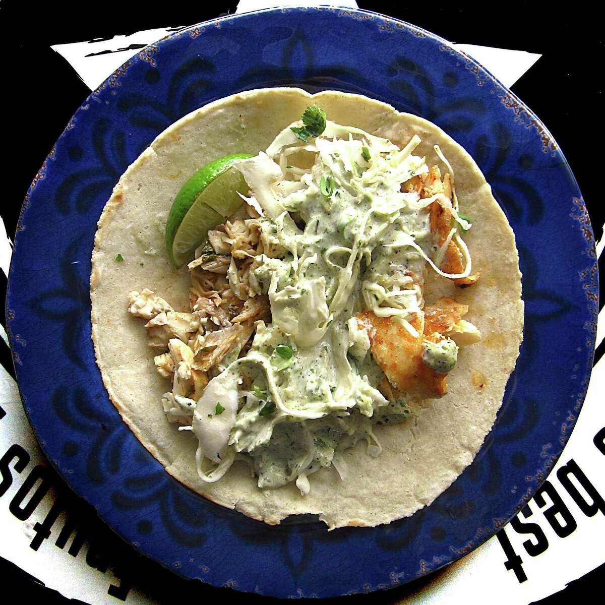 Grilled fish taco with cilantro-lime cabbage slaw and poblano cream sauce on a handmade corn tortilla from Beto's Alt-Mex.