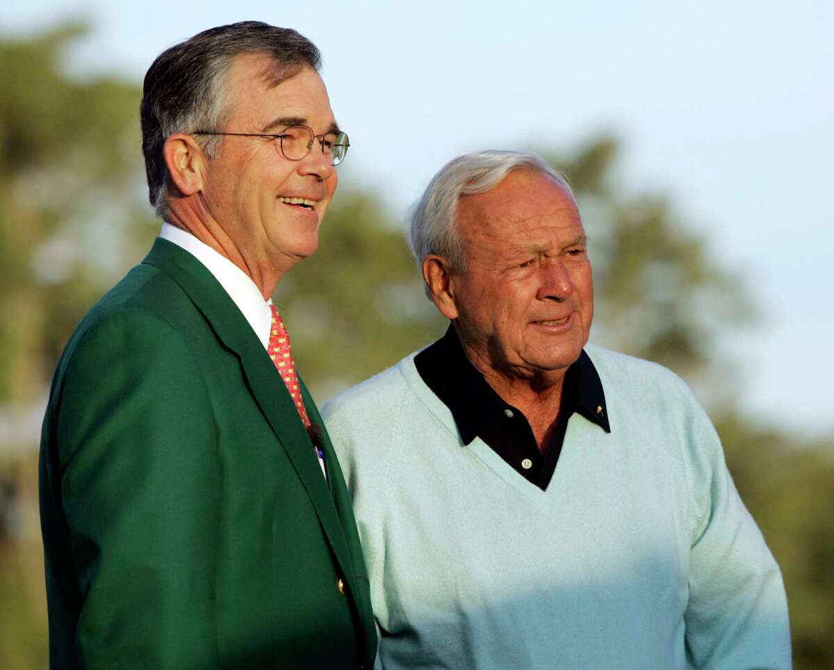 FILE - In this Thursday, April 5, 2007, file photo, Augusta National chairman Billy Payne, left, stands with honorary starter Arnold Palmer before the first round of the 2007 Masters golf tournament at the Augusta National Golf Club in Augusta, Ga. Payne announced Wednesday, Aug. 23, 2017, that he is retiring as chairman of the Augusta National Golf Club. (AP Photo/David J. Phillip, File)