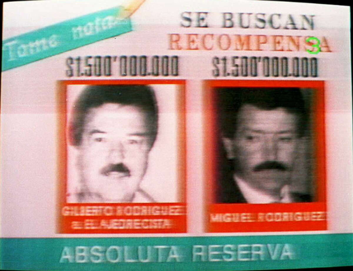 Gilberto Rodriguez Orejuela (left) and Miguel Angel Rodriguez Orejuela (right) - Season 3 Season 3 of "Narcos" focuses on the leaders of the Cali Cartel, Gilberto Rodriguez Orejuela and Miguel Angel Rodriguez Orejuela. This photo shows an advertisement that offers rewards for $1.5 million for information leading to the capture of the men.
