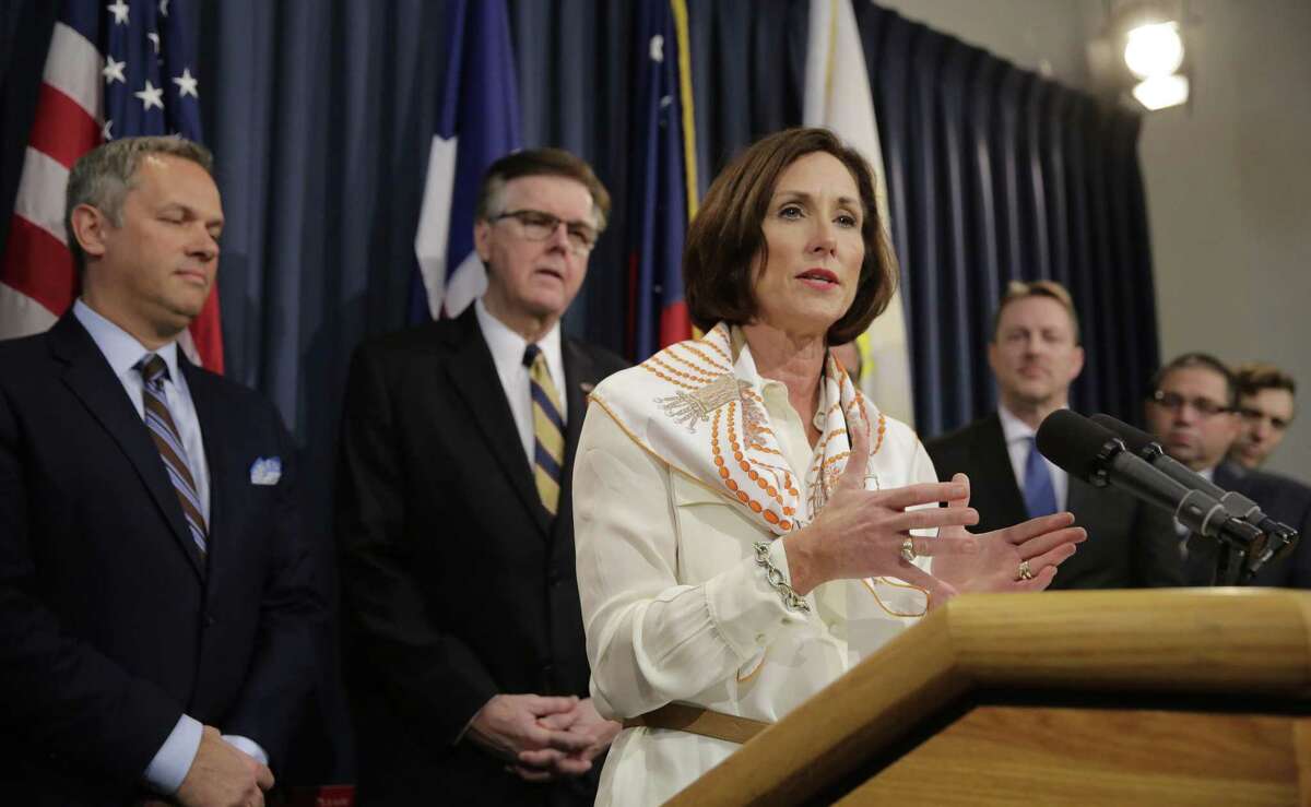 Texas Sen. Lois Kolkhorst, front, backed by Texas Lt. Gov. Dan Patrick, center, and other legislators talk to the media during a news conference to discuss Senate Bill 6 at the Texas Capitol in Austin. Texas has one of the highest maternal mortality rates in the developed world. The bill passed by the Legislature did not include 12 months of Medicaid coverage, which was the top recommendation of a task force looking to solve the problem.