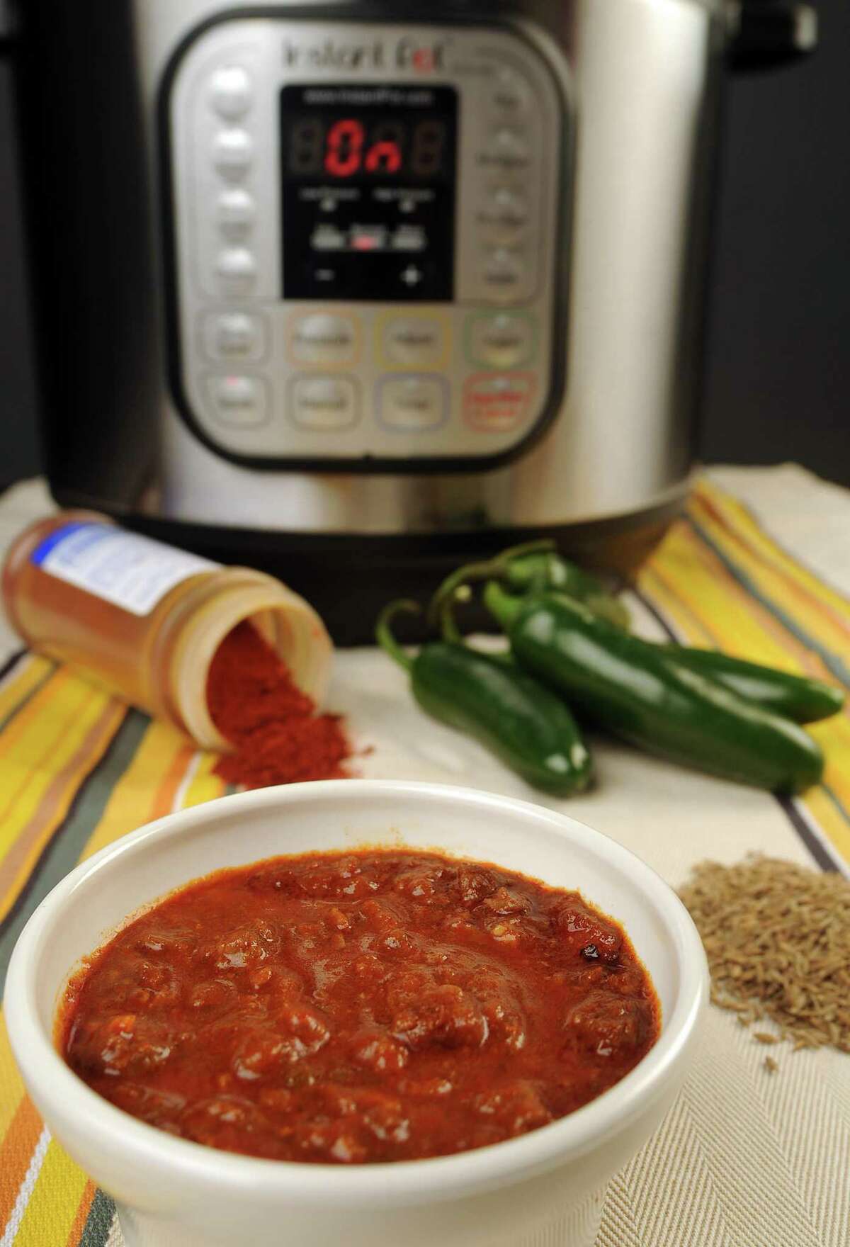 The Instant Pot programmable pressure cooker dramatically cuts down the time required to make long-simmered Texas favorites such as chili.
