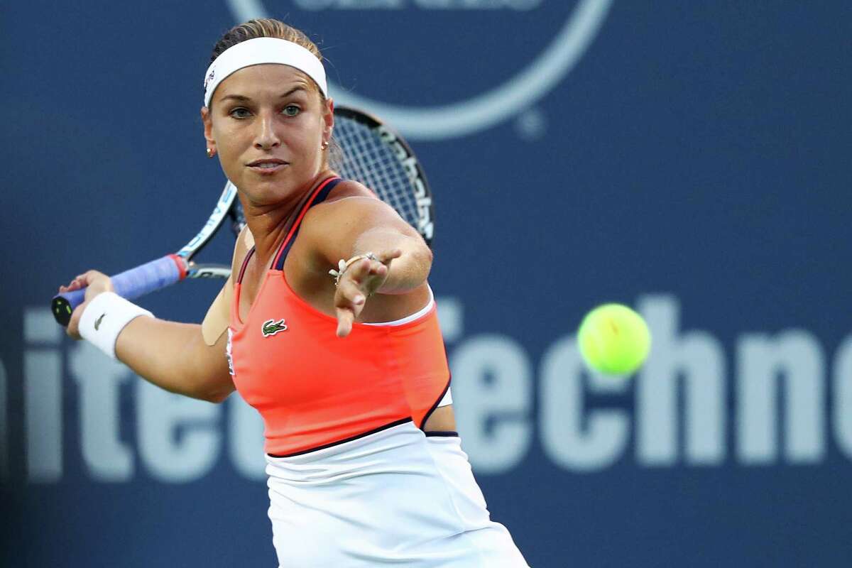 Dominika Cibulkova of Slovakia returns a shot to Alize Cornet of France on Wednesday night in New Haven at the Connecticut Open.