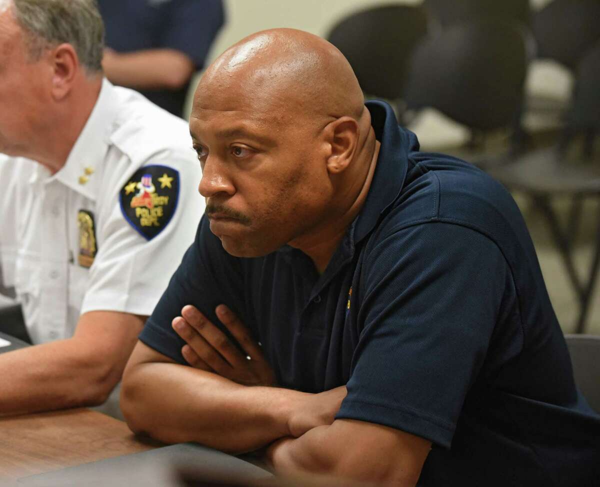 Aaron Collington, president of the Troy Police Benevolent Associatio, listens as Troy Police Chief John Tedesco speaks to the city council about the spate of shootings and fires that have plagued the city in recent weeks on Monday, July 24, 2017 at Troy City Court in Troy, N.Y. (Lori Van Buren / Times Union)