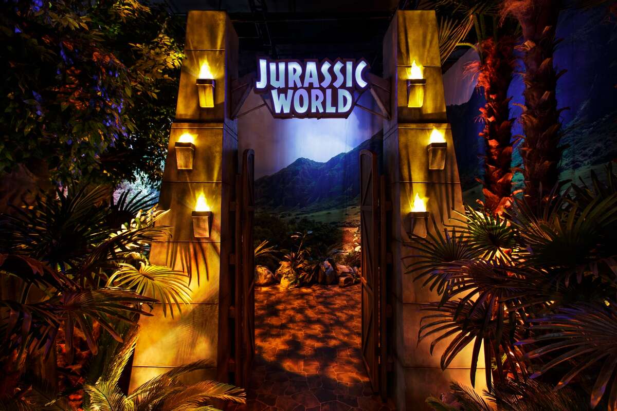 Pictured are scenes from Jurassic World: The Exhibition, which is on display at Chicago's Field Museum.