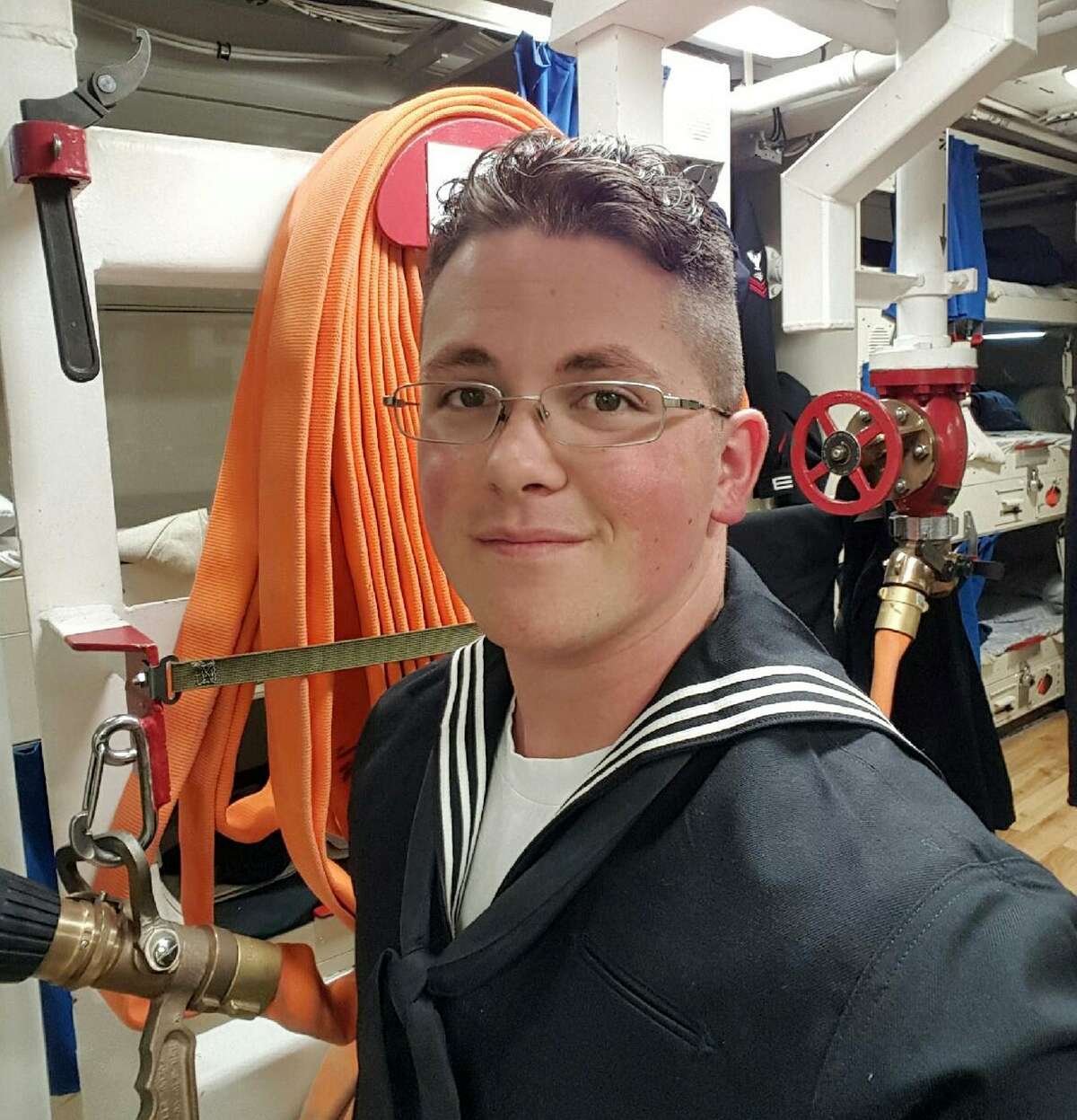 This undated photo provided by Cynthia Kimball shows her son John Hoagland aboard the USS John McCain. Kimball said Wednesday, Aug. 23, 2017, the Navy told her that her son is among the missing seamen who were aboard the USS John McCain when it collided with an oil tanker near Singapore Monday, Aug. 21. (Cynthia Kimball via AP)