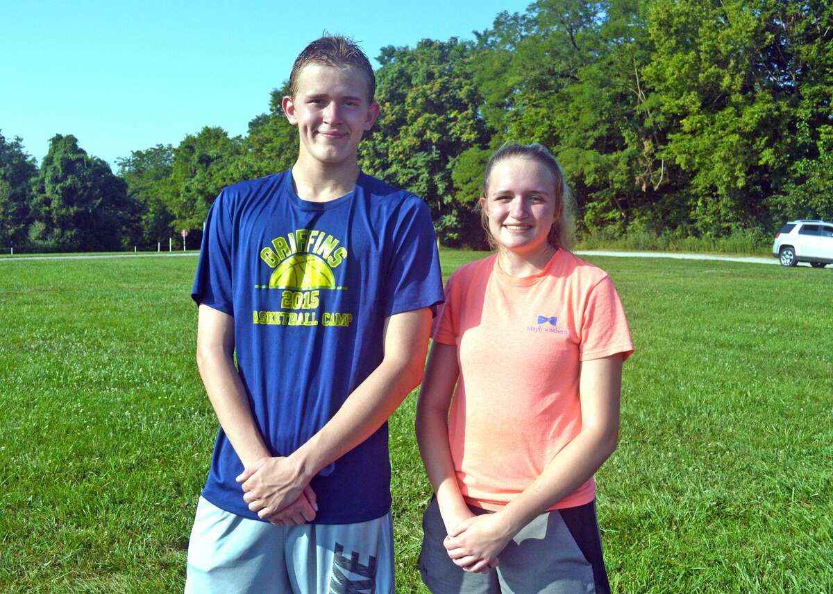 Seniors on the Father McGivney cross country team are Alex Loeffler, left, and Abby Podshadley. Other seniors are Abbey Bloodworth and Dan Jones.