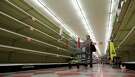 Shoppers pass empty shelves along the bottled water isle in a Houston grocery store as Hurricane Harvey intensifies in the Gulf of Mexico, Thursday, Aug. 24, 2017. Harvey is forecast to be a major hurricane when it makes landfall along the middle Texas coastline. (AP Photo/David J. Phillip)