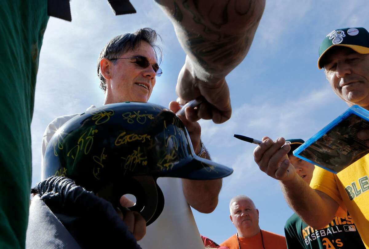 A's general manager BIlly Beane signs autographs for fans at the Papago Baseball facility in Phoenix, Arizona on Saturday Feb. 22, 2014. The Oakland Athletics continue their spring training schedule in the Arizona desert in preparation for the 2014 MBL season.