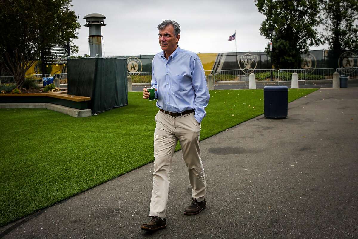 Billy Beane walks through the Oakland Alameda County Coliseum during a portrait session in Oakland, Calif., on Monday, Aug. 14, 2017.