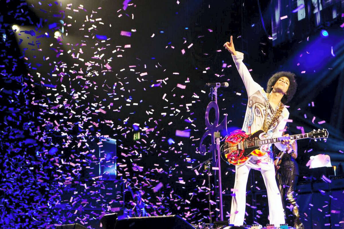 In this 2014 photo, Prince performs in Birmingham, England.