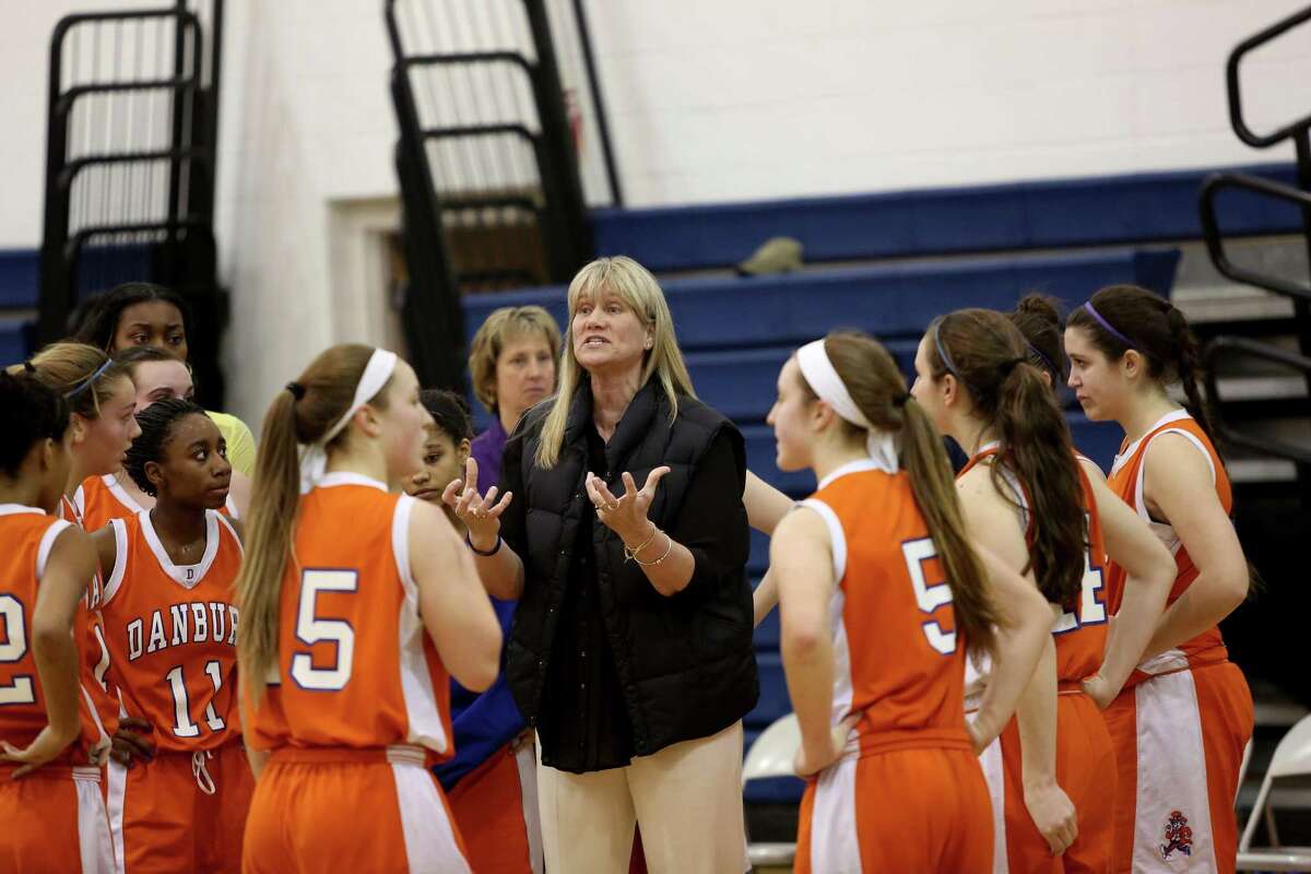 Mike Ross Connecticut Post freelance -Danbury’s head coach Jackie DiNardo instructions players during timeout during first half action at Thursday’s CIAC Class LL Basketball tournament quarterfinals against Lauralton Hall.