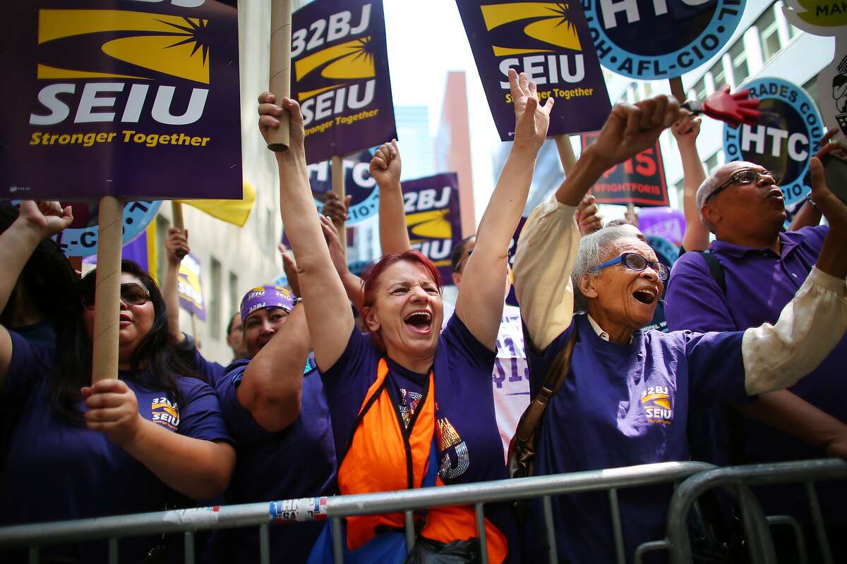 FILE � Service Employees International Union members rally in support of raising the minimum wage, in New York, July 22, 2015. The SEIU will fund an extensive campaign to elect politicians with labor-friendly stands on the minimum wage, unions and health care in the build-up to the 2018 elections, it announced on Aug. 24, 2017. (Chang W. Lee/The New York Times)