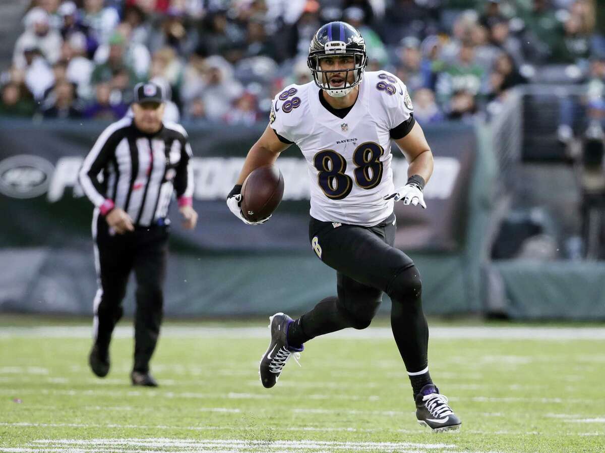 In this file photo, Baltimore Ravens tight end Dennis Pitta (88) takes the ball up field against the New York Jets during the second quarter of an NFL football game, in East Rutherford, N.J. The Ravens have released Pitta with an injury waiver after he hurt his right hip for a third time in practice last week. The injury occurred during an offseason practice session Friday. Each time Pitta hurt the hip previously, the injury was serious enough to be considered career-threatening. That appears to be the case again following his release Wednesday.