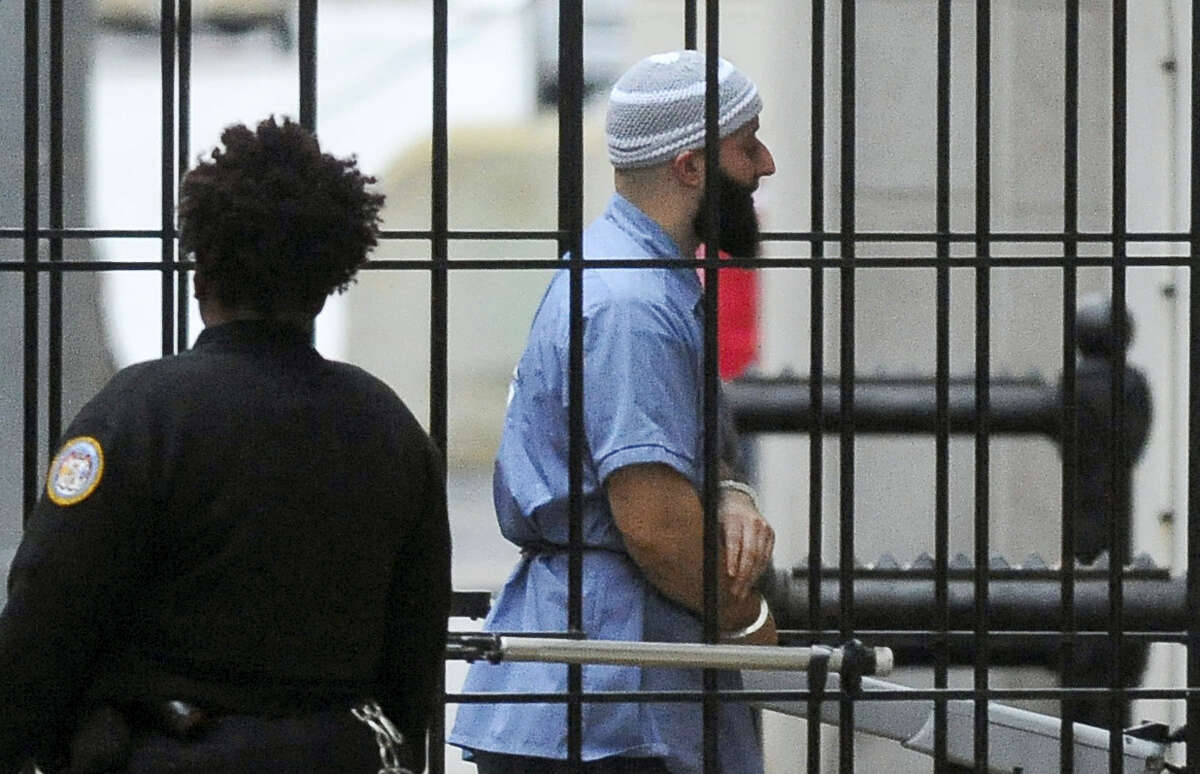 In this Feb. 3, 2016 file photo, Adnan Syed enters Courthouse East in Baltimore prior to a hearing in Baltimore. Attorneys for Syed, convicted of killing his high school sweetheart, and whose story is at the center of the popular podcast “Serial,” will argue Thursday, June 8, 2017 that he deserves a new trial after his conviction was vacated.
