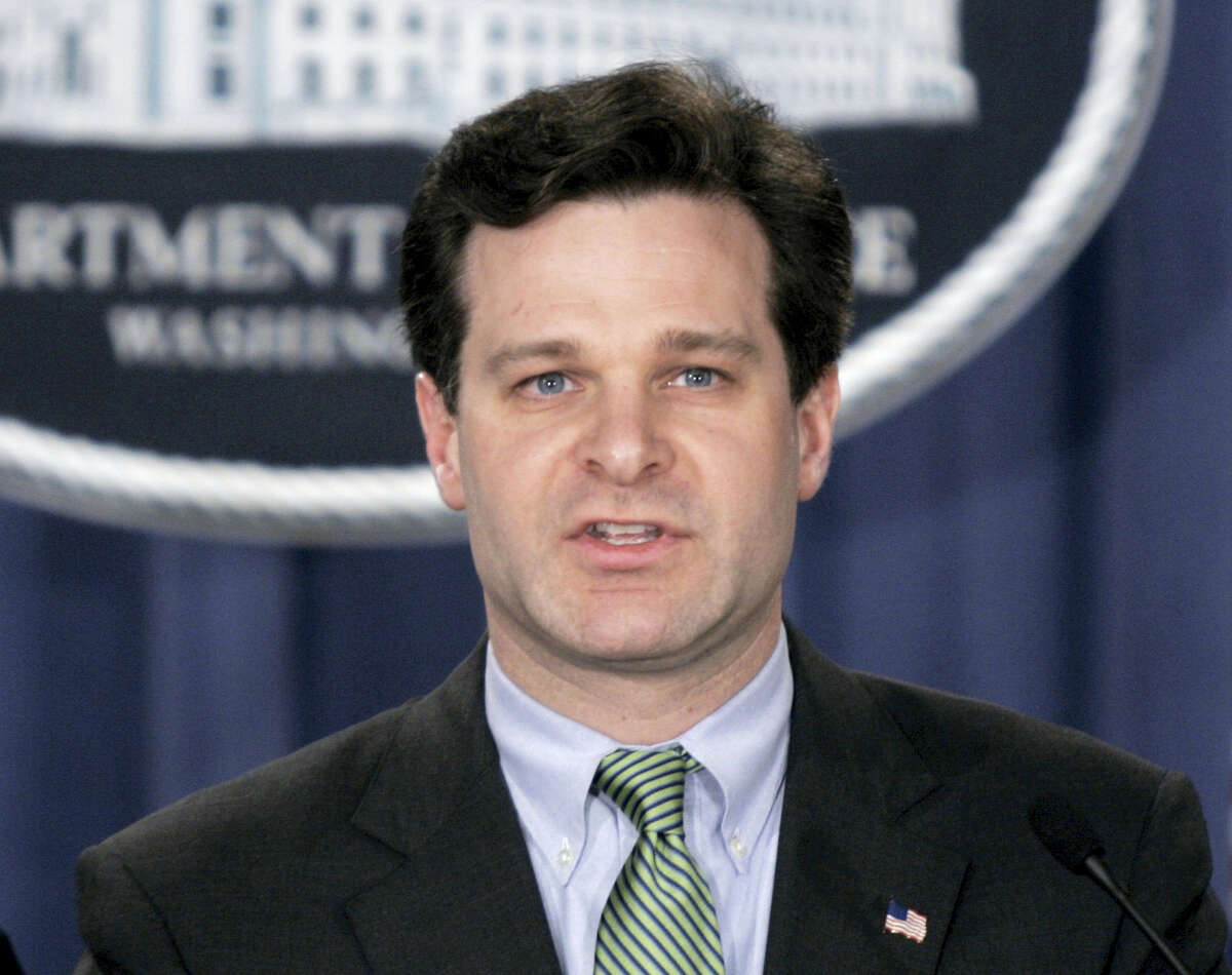 In this Jan. 12, 2005, photo, Assistant Attorney General Christopher Wray speaks at a press conference at the Justice Department in Washington. President Donald Trump has picked the longtime lawyer and former Justice Department official to be the next FBI director. Trump said on Twitter Wednesday that Wray is “a man of impeccable credentials.”