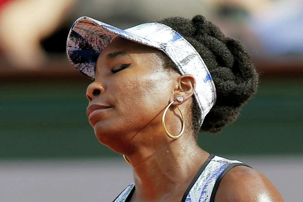 Venus Williams of the U.S. closes her eyes after missing a shot against Timea Bacsinszky of Switzerland during their fourth round match of the French Open tennis tournament at the Roland Garros stadium, in Paris, France on Sunday, June 4, 2017.
