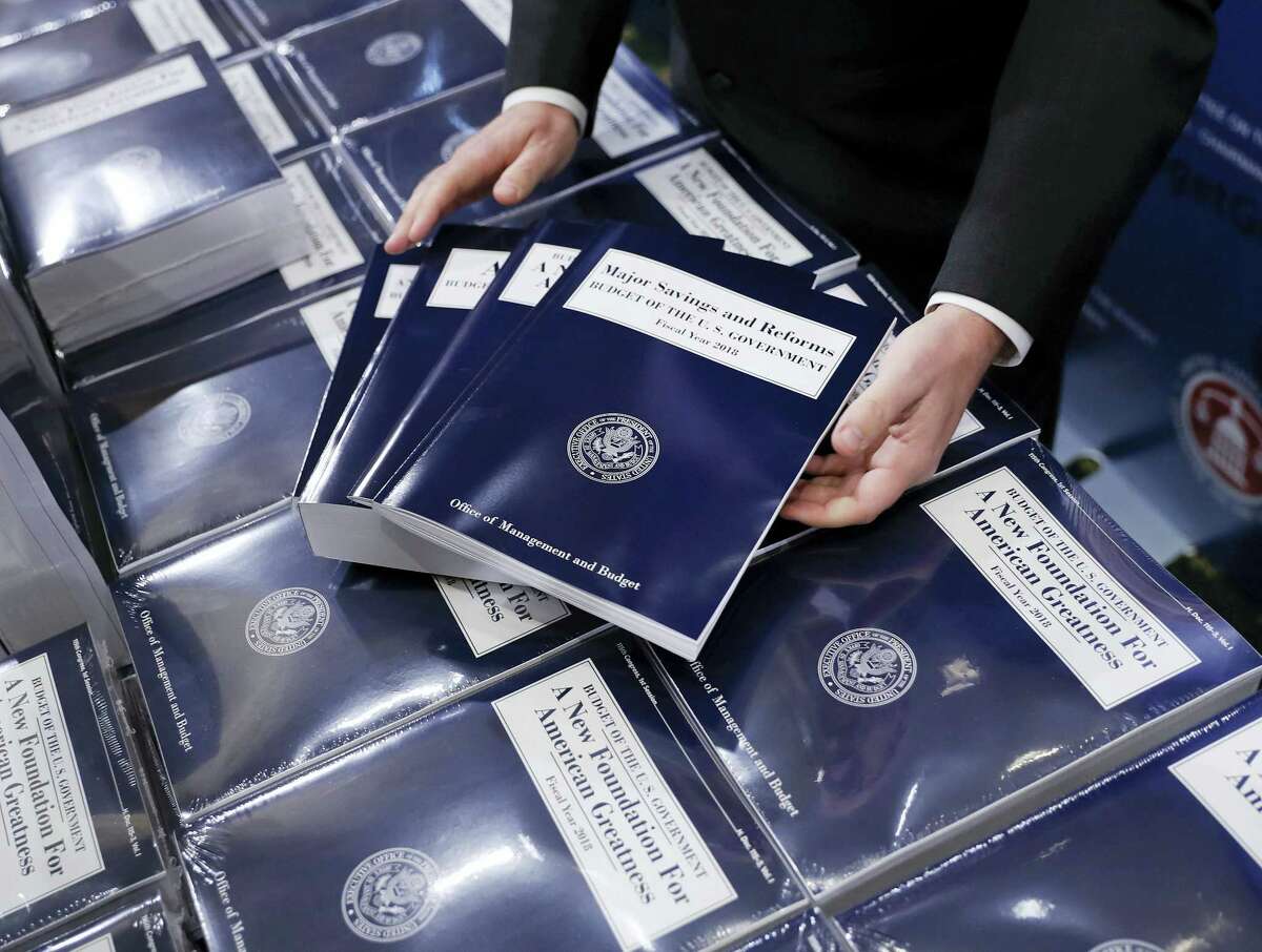 In this May 23, 2017 photo, copies of President Donald Trump’s fiscal 2018 federal budget are seen on Capitol Hill in Washington. Congress faces a burst of overdue budget-related work this summer, most of which probably won’t bear much resemblance to Trump’s budget, which promised deep spending cuts on domestic programs, rapid economic growth, and a balanced federal ledger in a decade.
