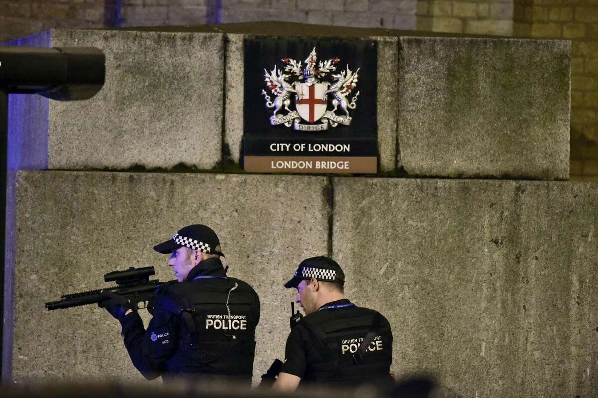 An armed Police officer looks through his weapon on London Bridge in London, Saturday, June 3, 2017. British police said they were dealing with “incidents” on London Bridge and nearby Borough Market in the heart of the British capital Saturday, as witnesses reported a vehicle veering off the road and hitting several pedestrians.