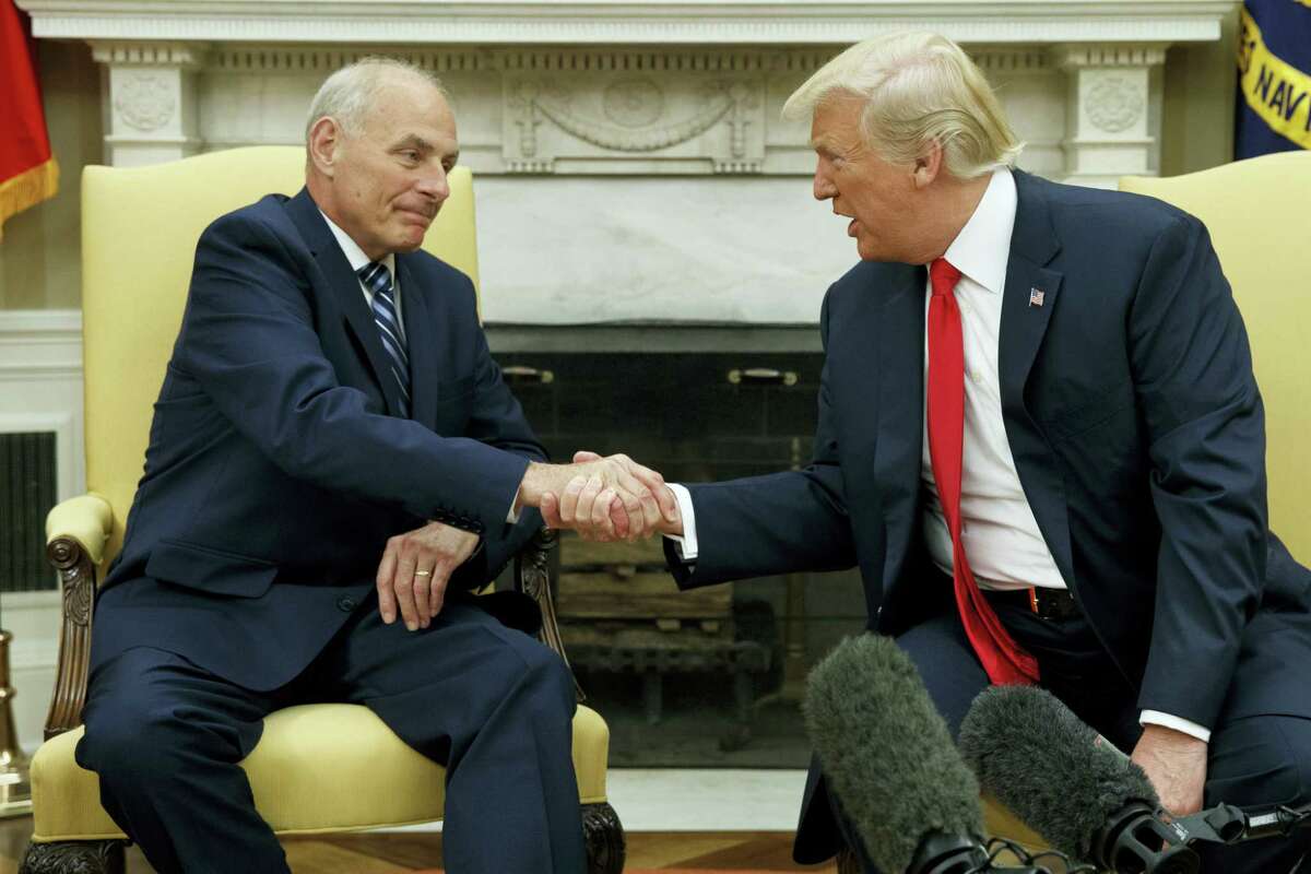 President Donald Trump talks with new White House Chief of Staff John Kelly after he was privately sworn in during a ceremony in the Oval Office with President Donald Trump on July 31, 2017 in Washington.